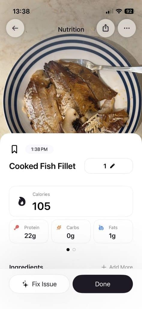 Plate with cooked fish fillet shown in a nutrition-tracking app; 105 calories, 22g protein, 0g carbs, 1g fat.